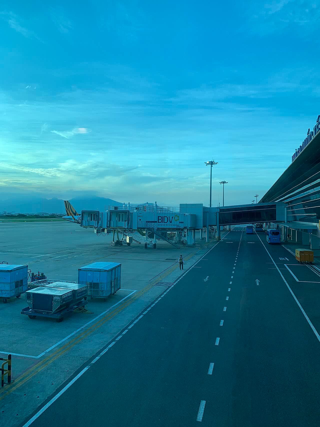 An airport apron and terminal at dawn